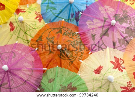 background of colorful cocktail umbrellas