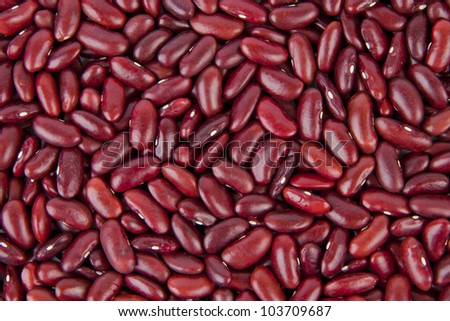 Kidney bean pulses forming a textured background.