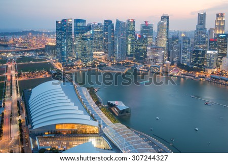 SINGAPORE - JUNE 25, 2015 : Singapore City Skyline and view of skyscrapers on Marina Bay at twilight on June 25, 2015 in Singapore.