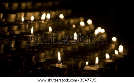 Prayer candles in cathedral at El Escorial, Madrid province, Spain