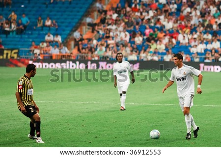 MADRID - JULY 26 :  Cristiano Ronaldo (R) of Real Madrid looks to dribble during Peace Cup at Santiago Bernabeu stadium July 26, 2009 in Madrid. Real Madrid 1-1 draw with Al Ittihad.