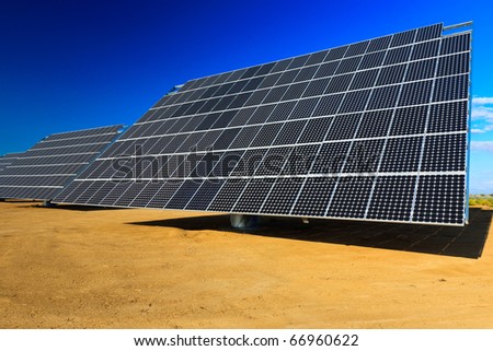 View of solar panels against a blue sky