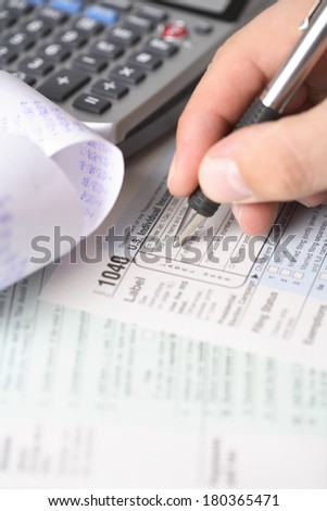 Tax preparation still life with hand writing information