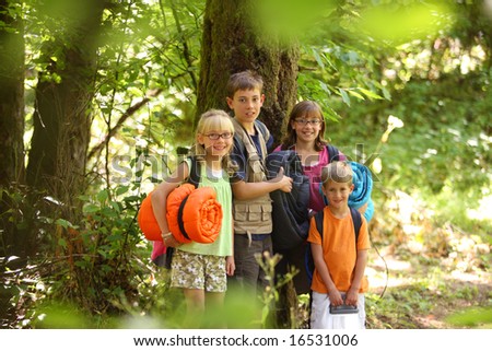 Group of kids outdoors with camping gear