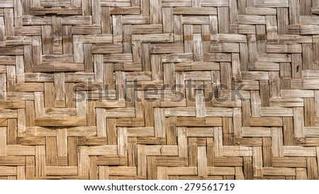 Natural wooden wall is made by bamboo wickerwork of traditional Thai house for interior design