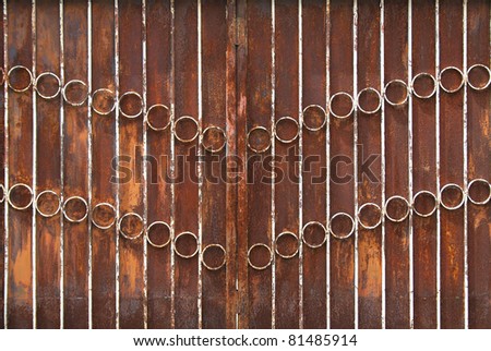 Pattern of grunge rusty metallic gate for background and texture