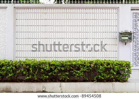 The white wall and letter box of the house