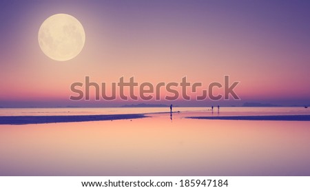 Full moon over blue sea and sky ,Long exposure technique with vintage filter