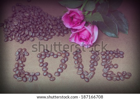 Love coffee beans text and pink rose with vintage filter effect