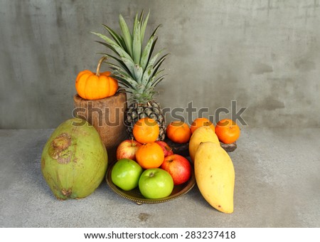 Still life apple, pineapple,pumpkin,tangerine,coconut  and mango fruit in vintage style