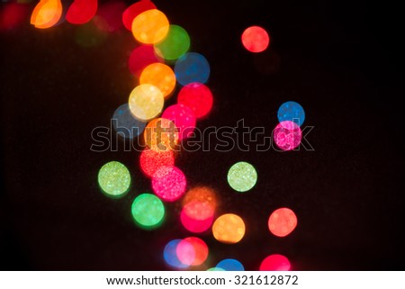 Abstract Christmas sparkling multicolor light defocused bokeh background
