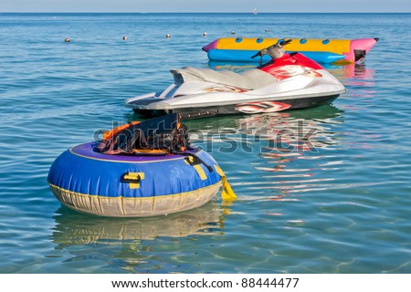 Group of life jackets on life buoy jet ski and banana boat in the