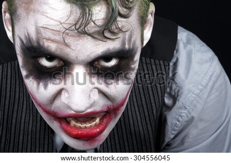 Dark creepy joker face screaming angry