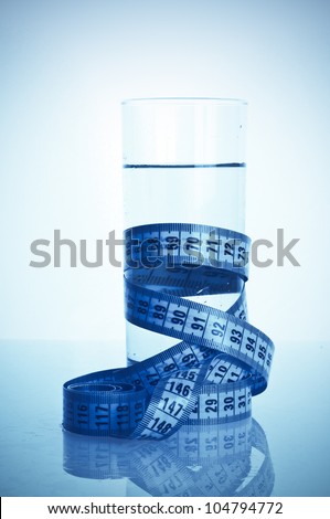 glass of clean water with a measuring