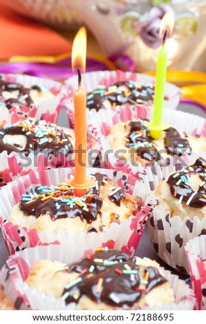 cupcake with sprinkles and candle. birthday