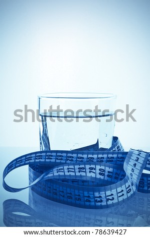 glass of clean water with a measuring
