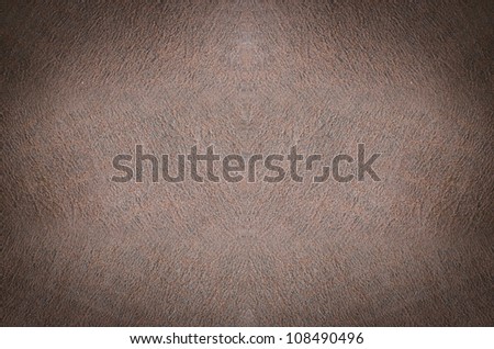 Background of crumpled dense fabric colored in brown  tones