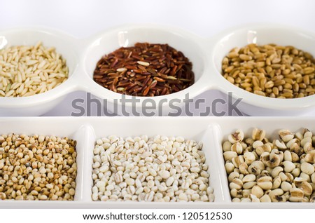 Grain and Cereal Set ,  rice , red rice , wheat,  job\'s tears , barley and millet grains on white bowl