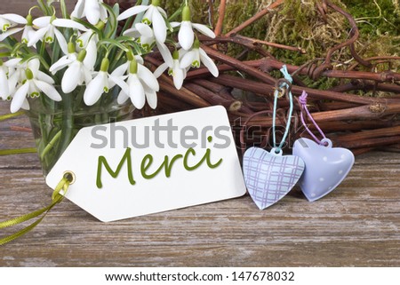snowdrops, twigs, hearts and  card with lettering thank you/thank you/snowdrops