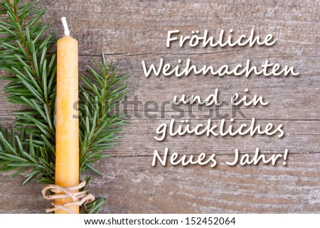 christmas card with fire and candle/Merry Christmas and a happy new year/german