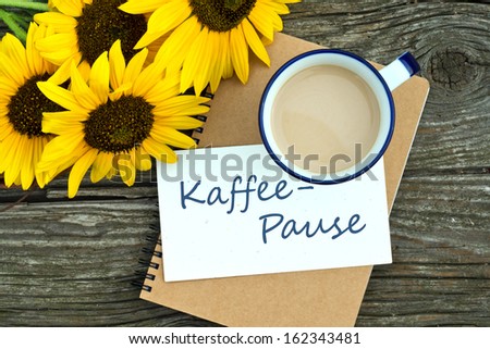 Sunflowers, coffee mug and ring binder/coffee break/german