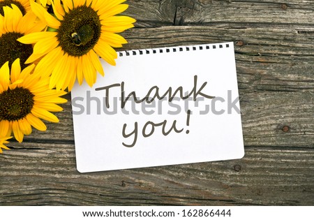 Sunflowers and card with lettering thanks/thank you/english
