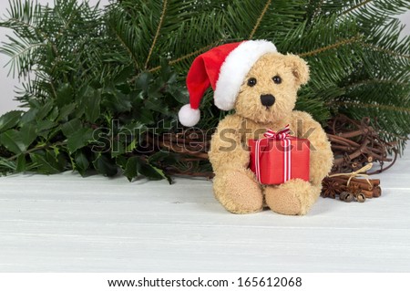 Teddy bear with santa hat and gift/christmas/teddy bear