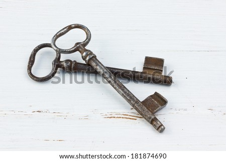 Old keys on white wood /old key/wood