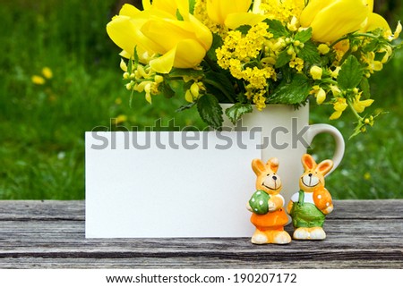 Bouquet with yellow tulips, easter bunnies and card/easter/flowers
