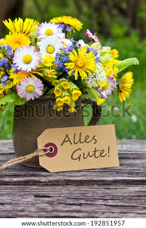 german greeting card with spring flowers/all the best/german