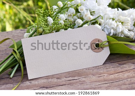 Lily of the valley, lilac, elder and label/flowers/May