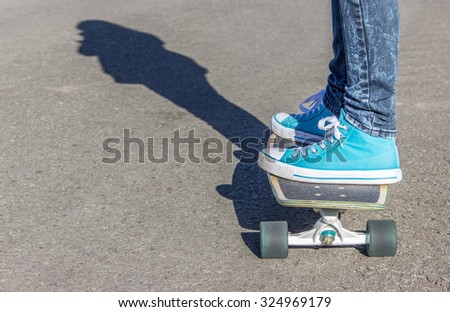 Skate board / Girl with blue shoes on a skateboard / Skate board / blue shoes