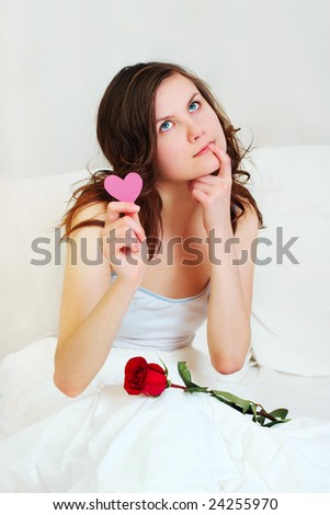 thinking girl in bed with valentine and rose