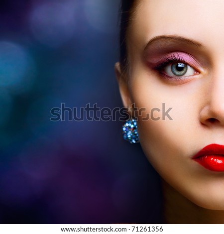portrait of beautiful fashionable woman on dark background