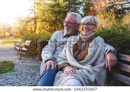 Similar – Image, Stock Photo Senior couple enjoying autumn colors together