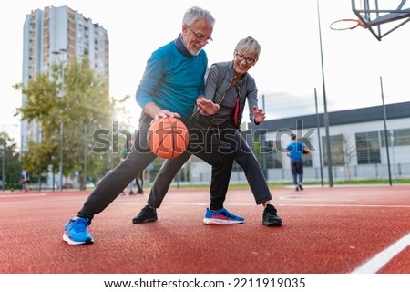Image, Stock Photo Joyful couple on playground against grassy field