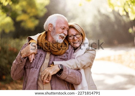 Similar – Image, Stock Photo Senior couple in autumn park