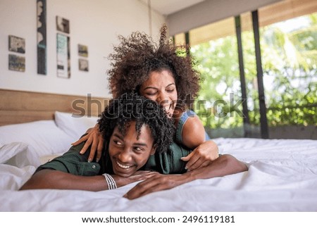 Image, Stock Photo Couple lying on bed and hugging in morning in nightwear