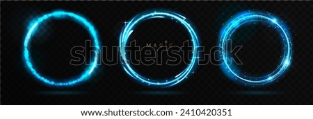 Set of Magic blue glowing shiny trails or circles isolated on black transparent background. Vector illustration