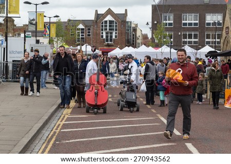 BISHOP AUCKLAND, ENGLAND - April 19, 2015: People Shopping in Bishop Auckland Food Festival. Bishop Auckland Food Festival is organised by Durham County Council.