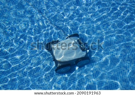 Similar – Image, Stock Photo Swimming pool cleaner robot during vacuum service, maintenance. Top view