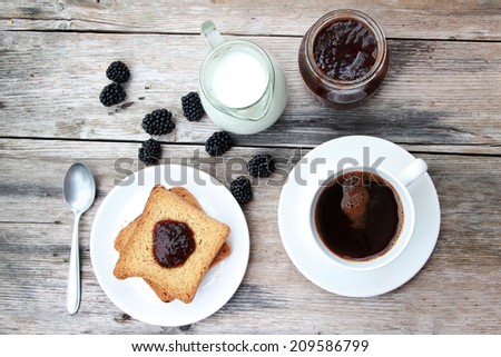 Morning coffee, Toast with marmalade and coffee on wooden table