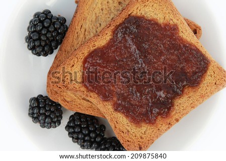 Toast with jam Toast with berries jam on white plate