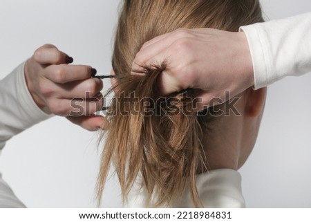 Similar – Image, Stock Photo Young Woman Tying Back Hair and Smiling in Bathroom