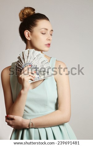 Woman with money, Fashion portrait of young woman with bunch of dollar bills