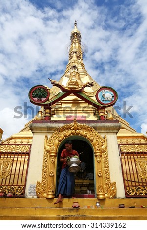 YANGON, MYANMAR - OCT 7: Unidentified people come to pray at  Sule Pagoda on October 7, 2012 in Yangon, It is a landmark of Sule Pagoda located in the heart of Yangon