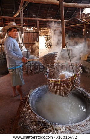 NAN, THAILAND - DEC 10: Unidentified people worker salt in countryside village at Amphoe Bo Klueaon December 10, 2011 in Nan, Thailand. It is a place with magic mountain of salt in the world