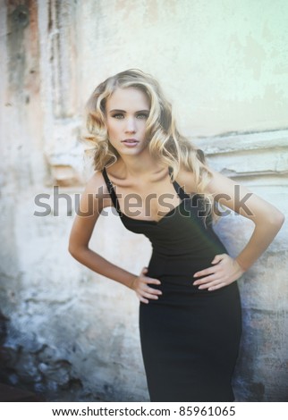 young sexy woman in a little black dress