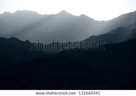 The Hajar Mountains on a hazy day at sunset