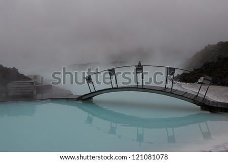 BLUE LAGOON, ICELAND - JUNE 16: Japanese style bridge in the famous Blue Lagoon on June 16, 2010 in Iceland. This geothermal spa is one of the most visited attractions in Iceland.